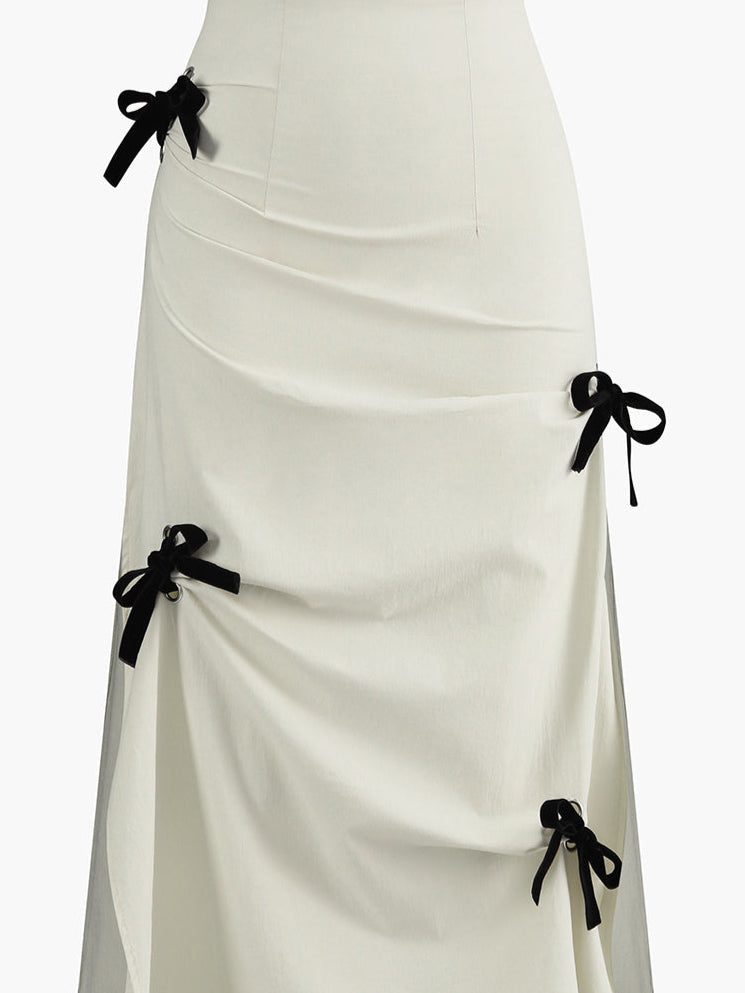 White Midi Skirt with Black Bows and Pleated Details – Elegant & Feminine