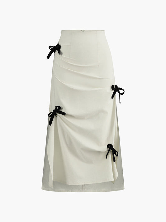 White Midi Skirt with Black Bows and Pleated Details – Elegant &amp; Feminine