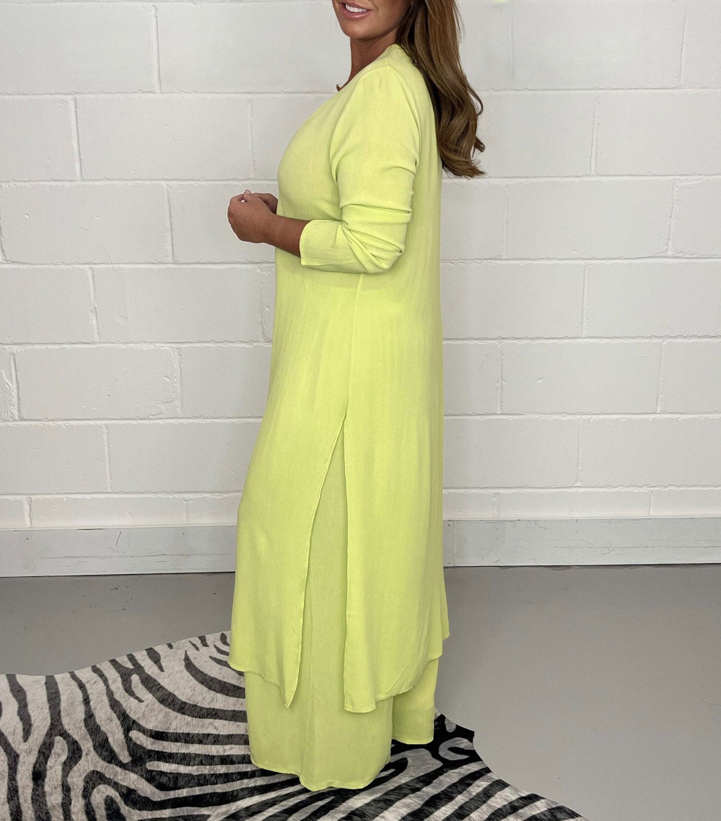 Two-piece women's set with V-neck dress and airy trousers