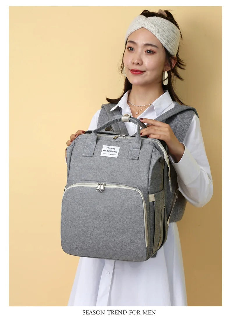 Multifunctional diaper backpack with baby nest and USB charging point